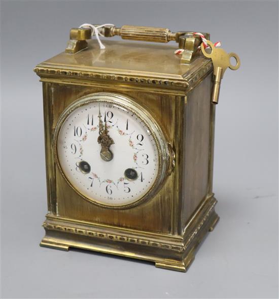 A French brass mantel clock with painted enamel dial height to top of handle hinge 17cm